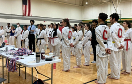 Several taekwondo athletes wait for their results at an ACATA tournament at UNC Charlotte.