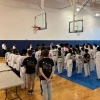 Several taekwondo athletes attend the opening ceremony at an ACATA tournament at UNC Chapel Hill.